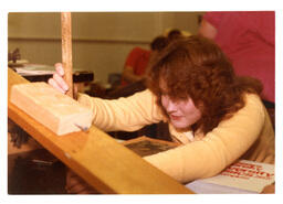 Student Measuring Something with Ruler (Part of the NMU Historic Photographs Collection)