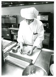 Kitchen Staff Using Meat Tenderizer (Part of the NMU Historic Photographs Collection)