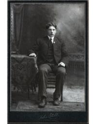 Julius Wiikman Sitting by Table