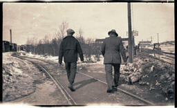 Two Men Walking on Tracks, 1 of 2