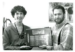 Two People Holding Plaque (Part of the NMU Historic Photographs Collection)