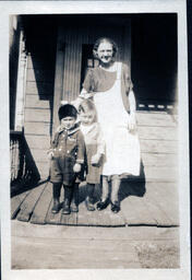 Woman with Two Children on Front Steps