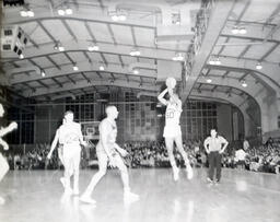 NMC Basketball--Aquinas Basketball 1960-61: Different View of Men on Basketball Court During Game