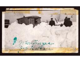 John Zugel, Joseph Gebeau, and Unknown Man behind Snow Bank