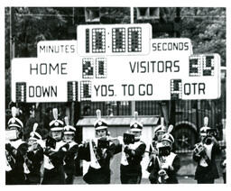 High School Marching Band Playing in front of Football Scoreboard (Part of the NMU Historic Photographs Collection)