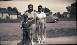 (008-010) Woman and Two Children Posing on Sidewalk