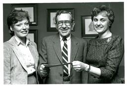 Three People Pose with Paper (Part of the NMU Historic Photographs Collection)