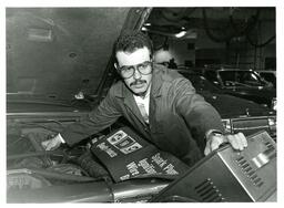 Mechanic Student Checking Car (Part of the NMU Historic Photographs Collection)