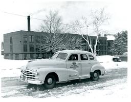 AAA Driver Training Car Driving Past J.D. Pierce Training School (Part of the NMU Historic Photographs Collection)