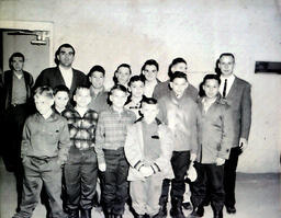 NMC Varsity N Club and Boys from Holy Family Orphanage Feb. 24, 1961: Closer Group Photo of Group of Boys and Men