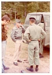 Four Men Standing Behind a Truck in the Woods (Part of the NMU Historic Photographs Collection)