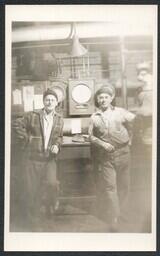 (020-001) Two Men Posing in front of Gauges