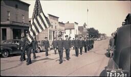 (008-035) Men in Military Uniforms Marching in Ontonagon Fourth of July Parade