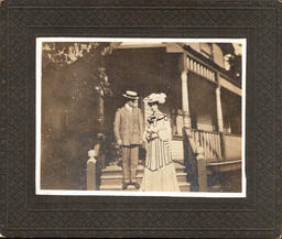 Man and Woman on Steps of Porch