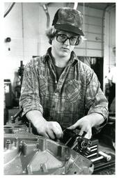 Student Working on an Engine Block (Part of the NMU Historic Photographs Collection)