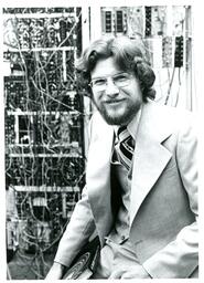 Portrait of Unknown Psychology Professor in front of Electrical Equipment (Part of the NMU Historic Photographs Collection)