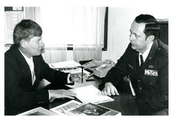 Staal and Unknown Man Speaking in Office (Part of the NMU Historic Photographs Collection)