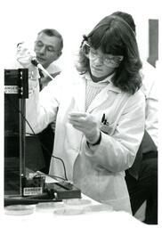 Student Doing Experiment in Lab (Part of the NMU Historic Photographs Collection)