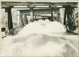 Flood Waters Rushing under Bridge (Front)