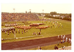 Several Marching Bands Performing on Football Field (Part of the NMU Historic Photographs Collection)