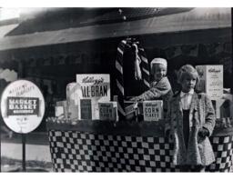 Joyce and Janice Harnish in a Kellogg's Market Basket Bicycle Float