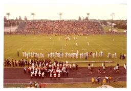 Marching Bands Standing on Sidelines of Football Field (Part of the NMU Historic Photographs Collection)