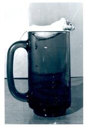 Mouse Sitting in Glass Mug (Part of the NMU Historic Photographs Collection)