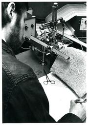 Student Doing Experiment on Mouse (Part of the NMU Historic Photographs Collection)