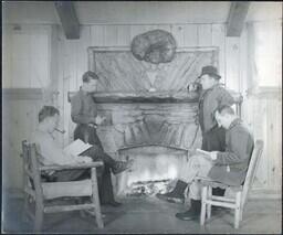 Four Men around Fireplace in CCC [Civilian Conservation Corps] Building