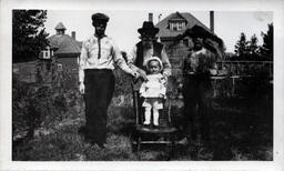 Young Tom Ross on Chair with Three Men