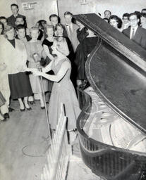 All Events Weekend 1959: Crowd Watching Woman Sing Near Piano