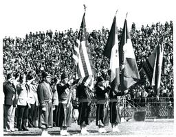 Shriners Presenting American and Other Flags at Football Game (Part of the NMU Historic Photographs Collection)