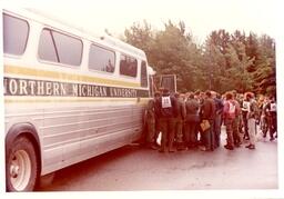 Group of People Standing next to Northern Michigan University Bus (Part of the NMU Historic Photographs Collection)