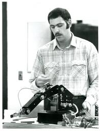 Student Operating Robot Arm (Part of the NMU Historic Photographs Collection)