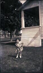 (132-009) Young Girl Playing Croquet