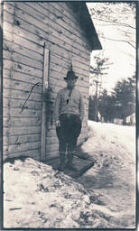 Man in Front of Wood House