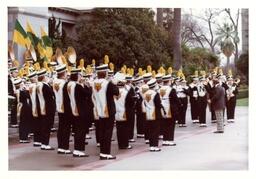 Closeup of Marching Band Performing in Front of Large Building and Palm Tree (Part of the NMU Historic Photographs Collection)