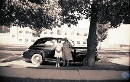 (007-018) Woman and Girl Posing in front of Car