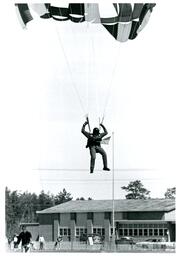 Parachutist Landing while People Watch (Part of the NMU Historic Photographs Collection)