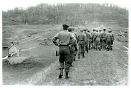 Men in Military Uniforms Marching in Field (Part of the NMU Historic Photographs Collection)