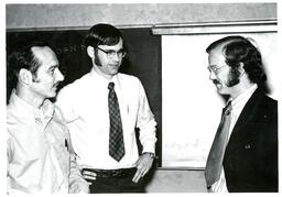 Three Men Speaking in Classroom (Part of the NMU Historic Photographs Collection)