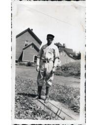 Tom Ross in Ontonagon Baseball Uniform in Yard