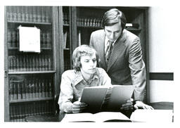 Professor and Student Looking at Book (Part of the NMU Historic Photographs Collection)