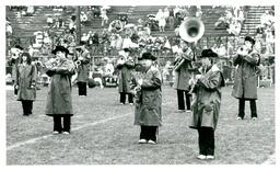 Marching Band Performing in Raincoats for Small Crowd (Part of the NMU Historic Photographs Collection)