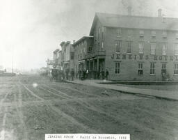 View of the east side of the 200 block of Stephenson Avenue, facing north, the Jenkins Hotel in foreground