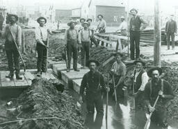 Iron Mountain city workers "boxing in" the mine creek on West Hughitt Street