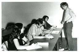 Professor Speaking to Four Students (Part of the NMU Historic Photographs Collection)