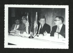 Four Men at Banquet Table