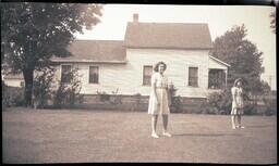 (043-001) Young Women in front of Dobbek Home