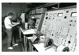 Student Working on Panel of Electronic Equipment (Part of the NMU Historic Photographs Collection)